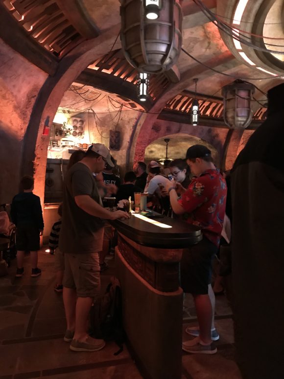 Table tops with people at Star Wars Galaxy's Edge Oga's Cantina